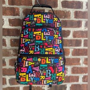 Vera Bradley Colorful Backpack with a collage of letters on black background.